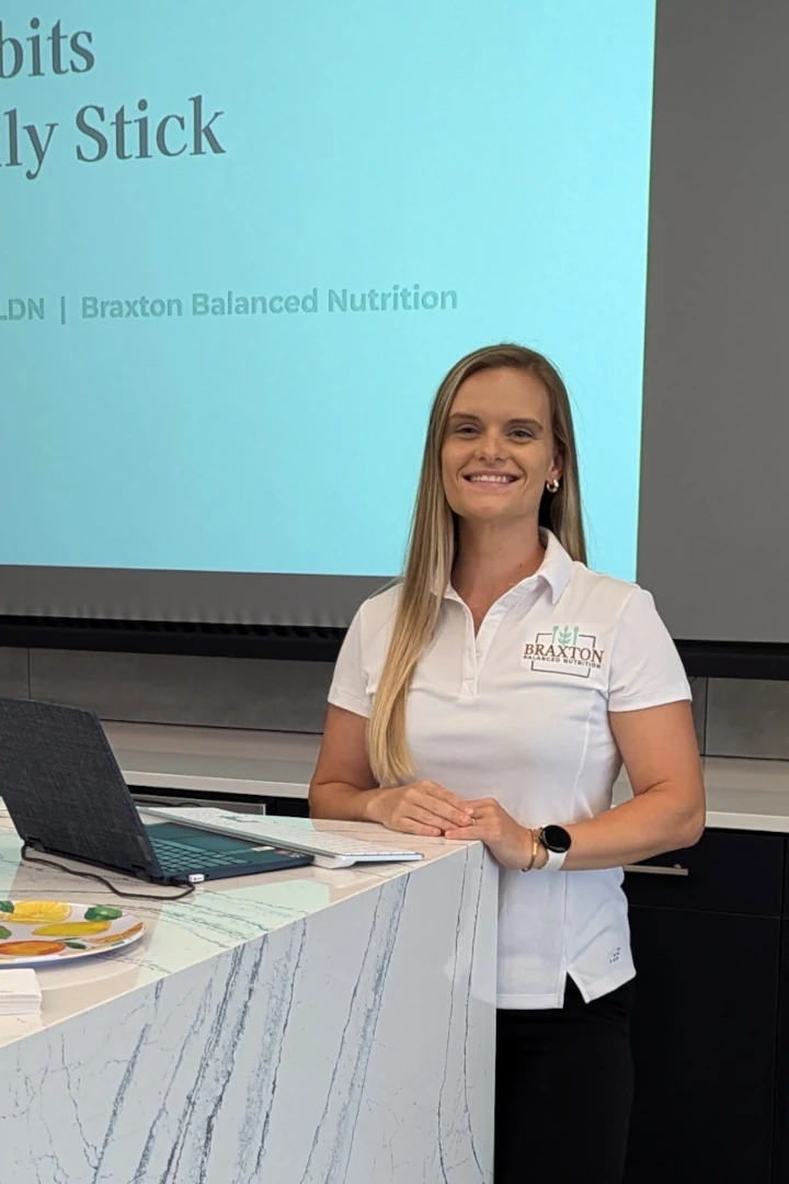 Rachel Braxton smiling before presenting at a workplace wellness workshop in Charlotte, North Carolina.